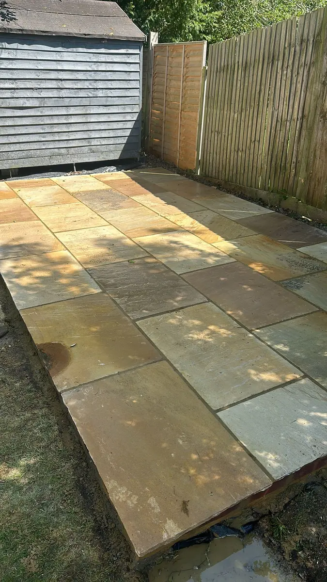 Close view of mint sandstone paving with sand and cement pointing, Claygate