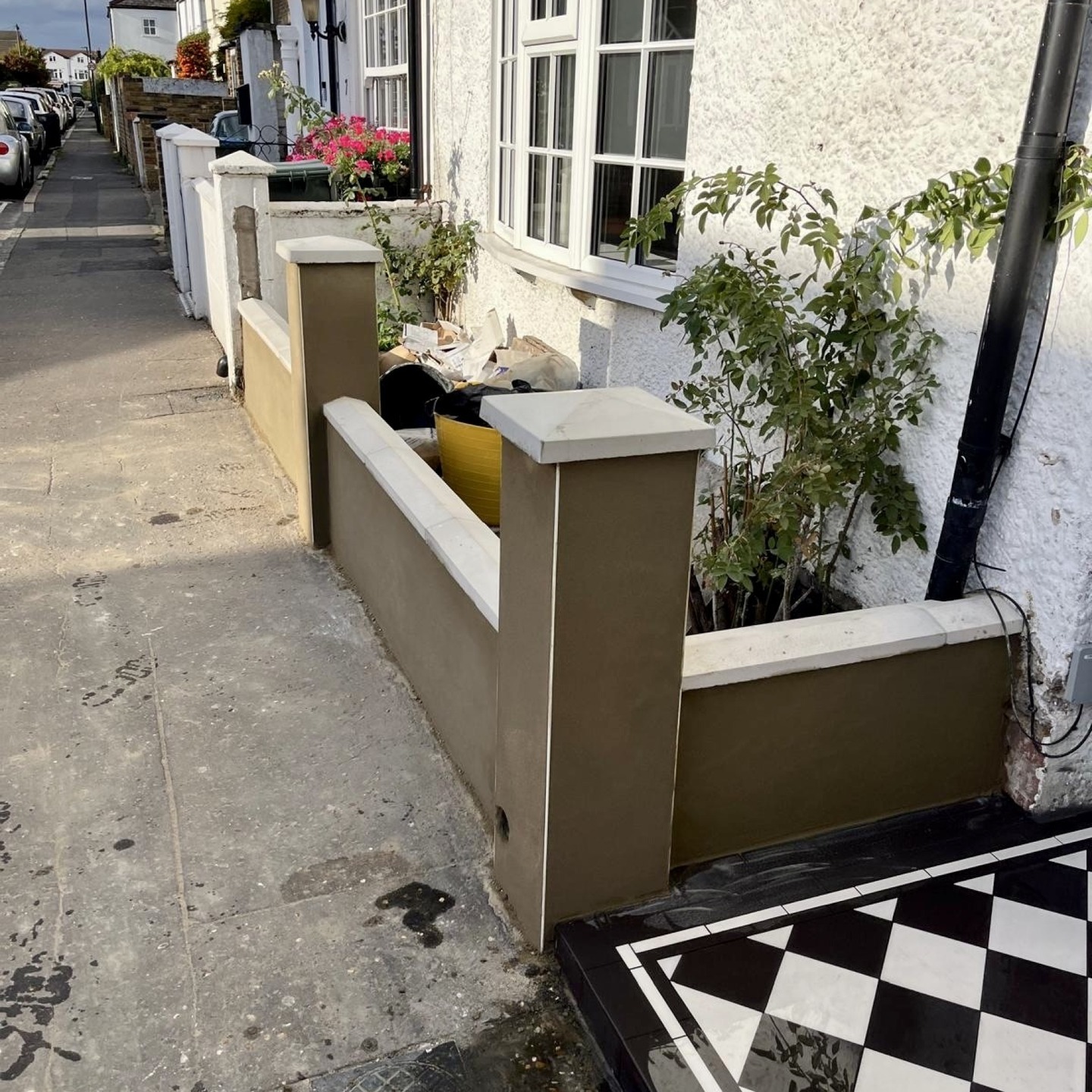 Finished front wall and Victorian tiled path at a Twickenham terrace seen from the pavement